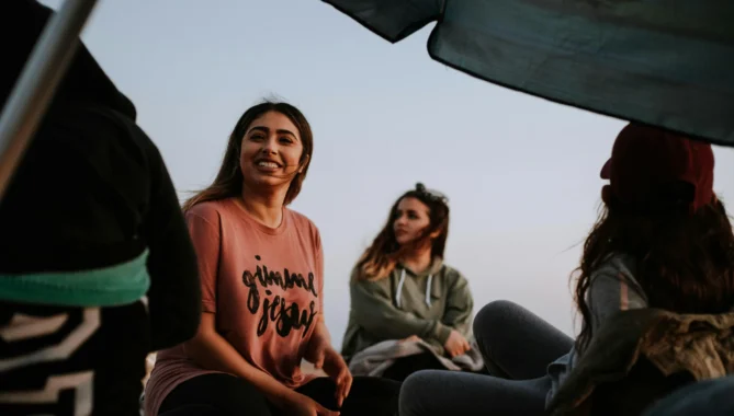 group of students enjoying break in a park