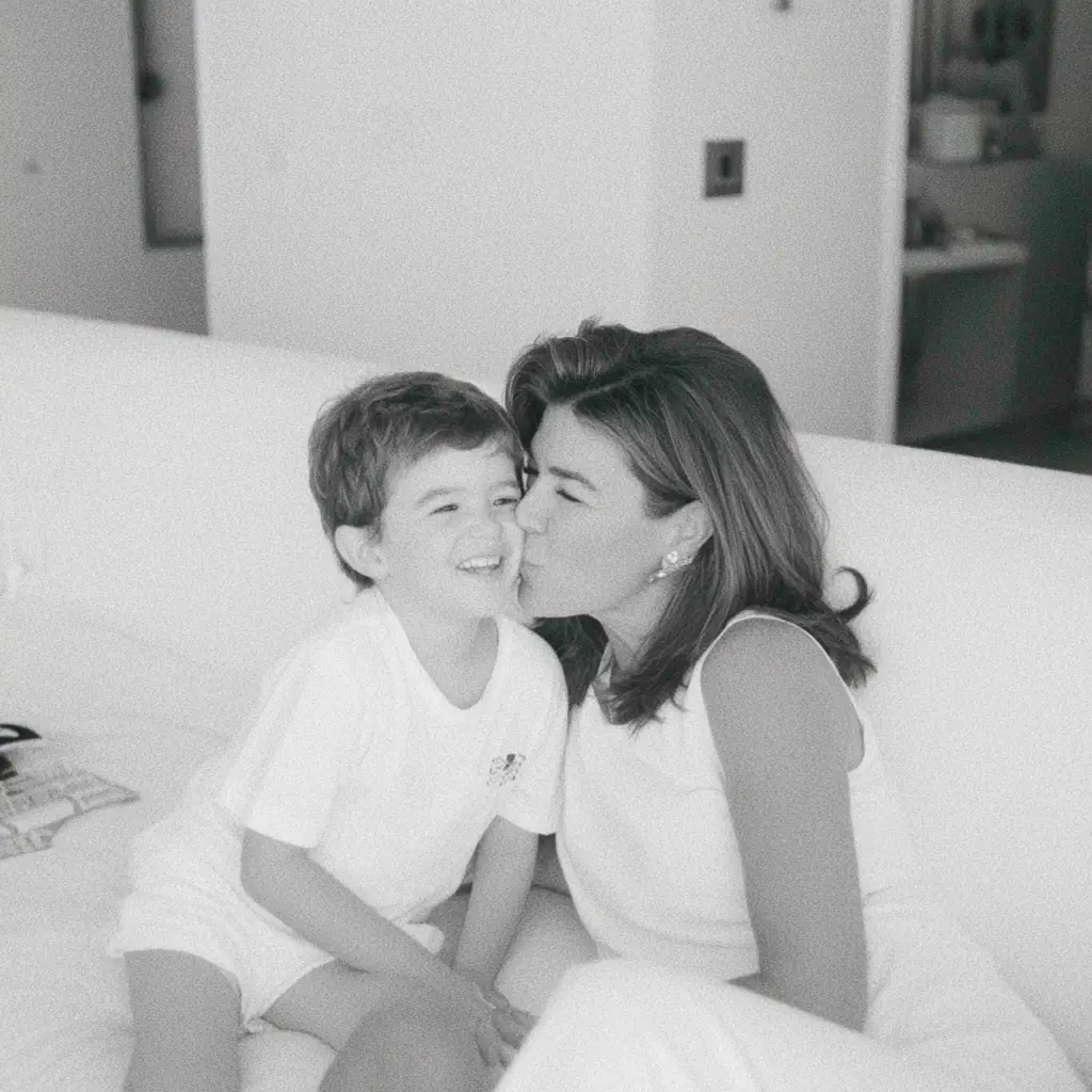 Mother and child on sofa, black and white photograph