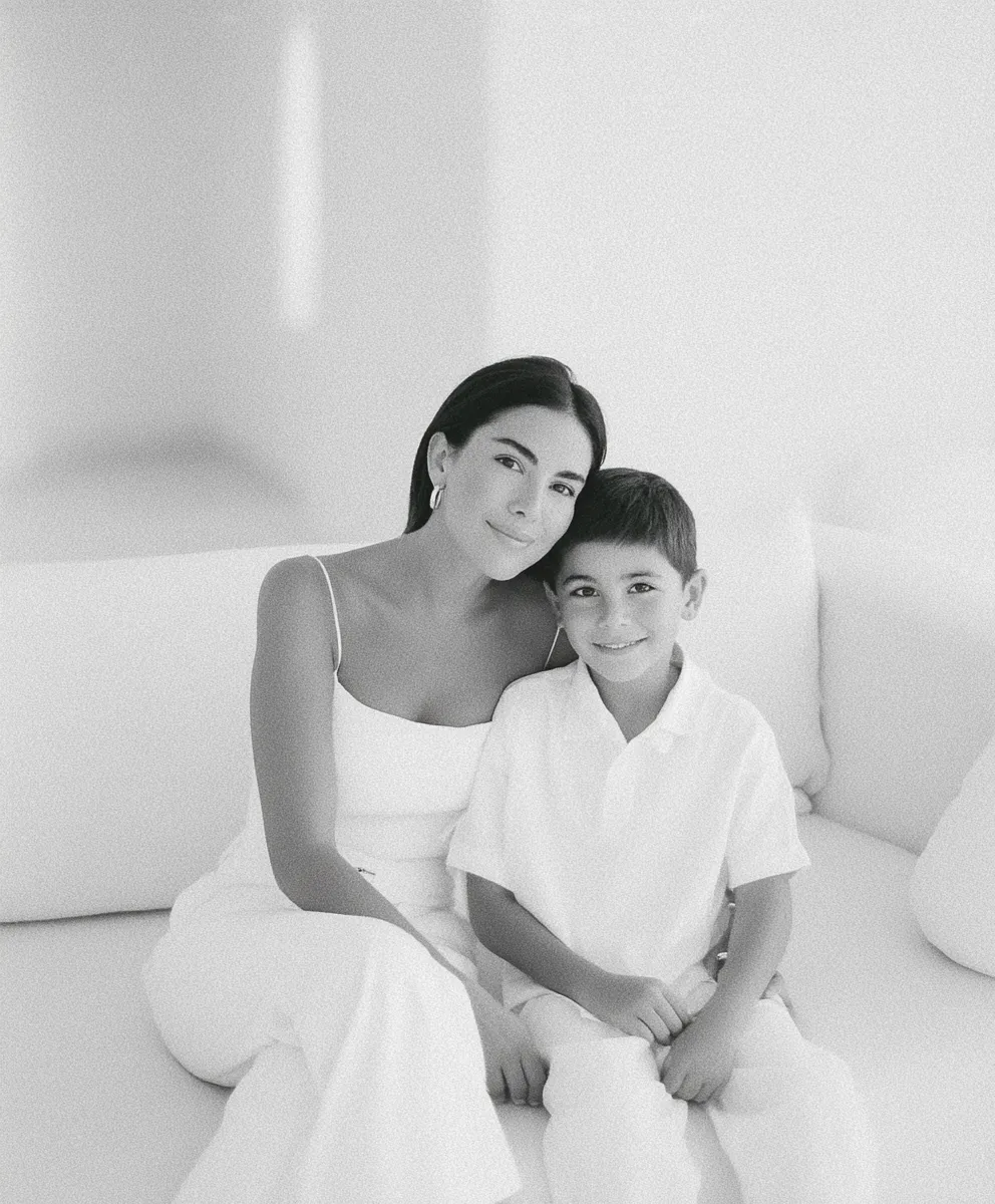 Mother and young son on sofa in black and white classy portrait photoshoot