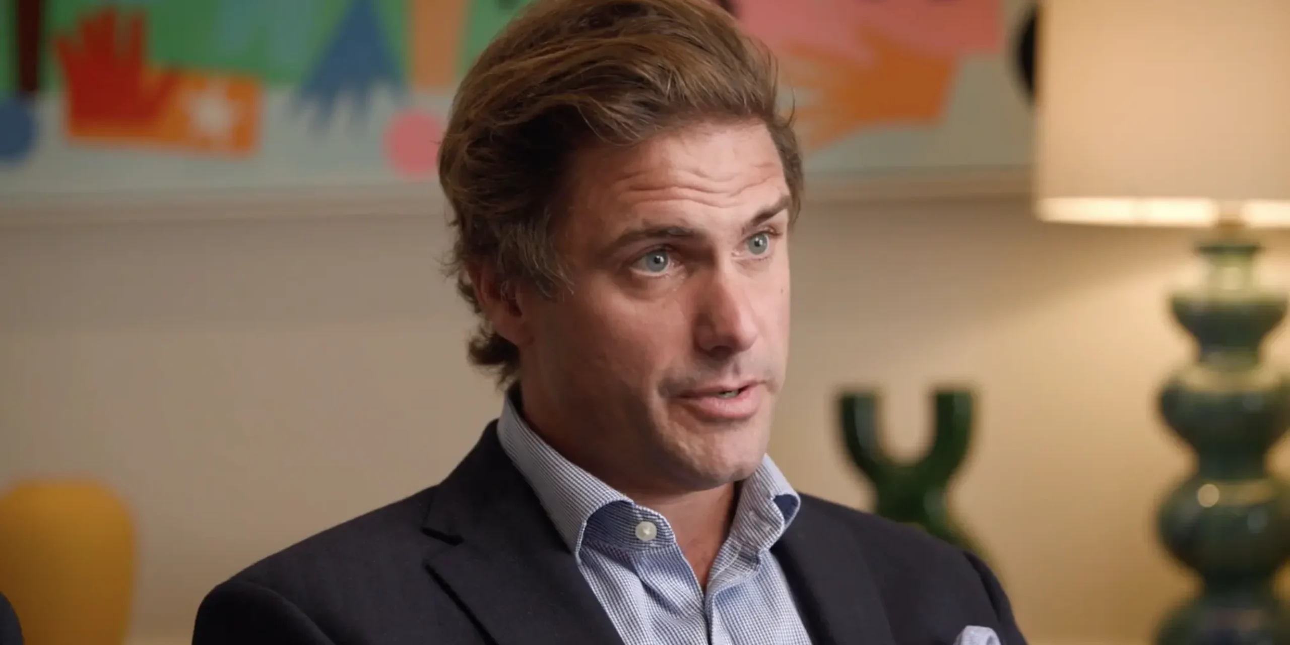 Rupert Syme giving interview