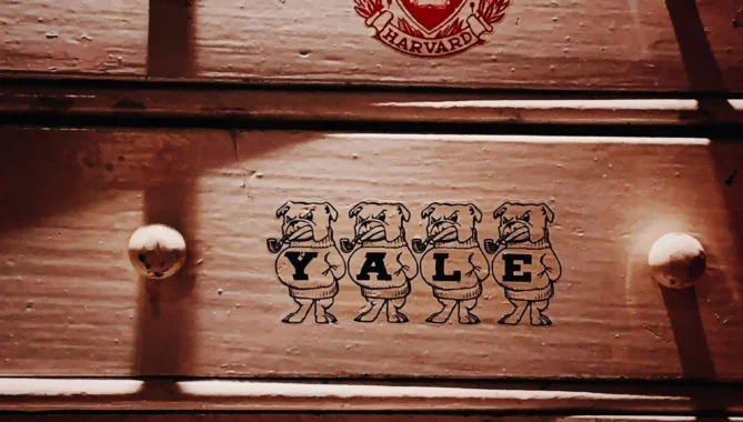 Harvard and yale trunks stacked on top of one another