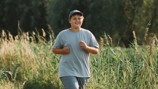 Boy jogging outside