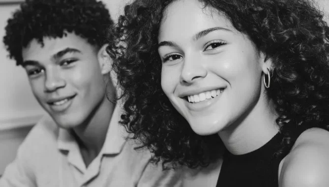 Two mixed race a level students smile